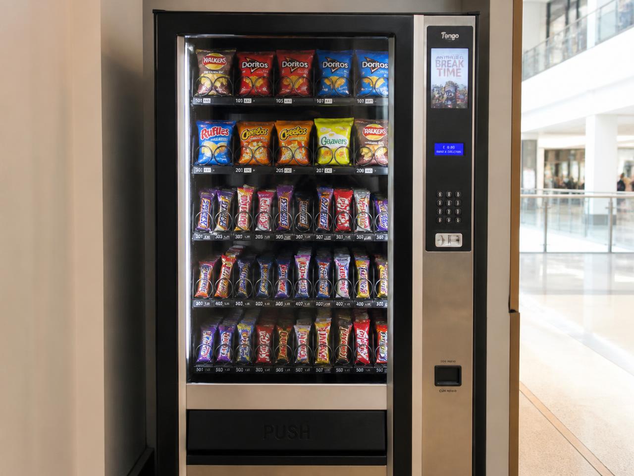 Snack vending machine placed in a shopping centre walkway